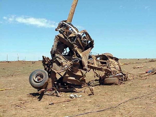 Large truck wrapped around pole and stripped of metal