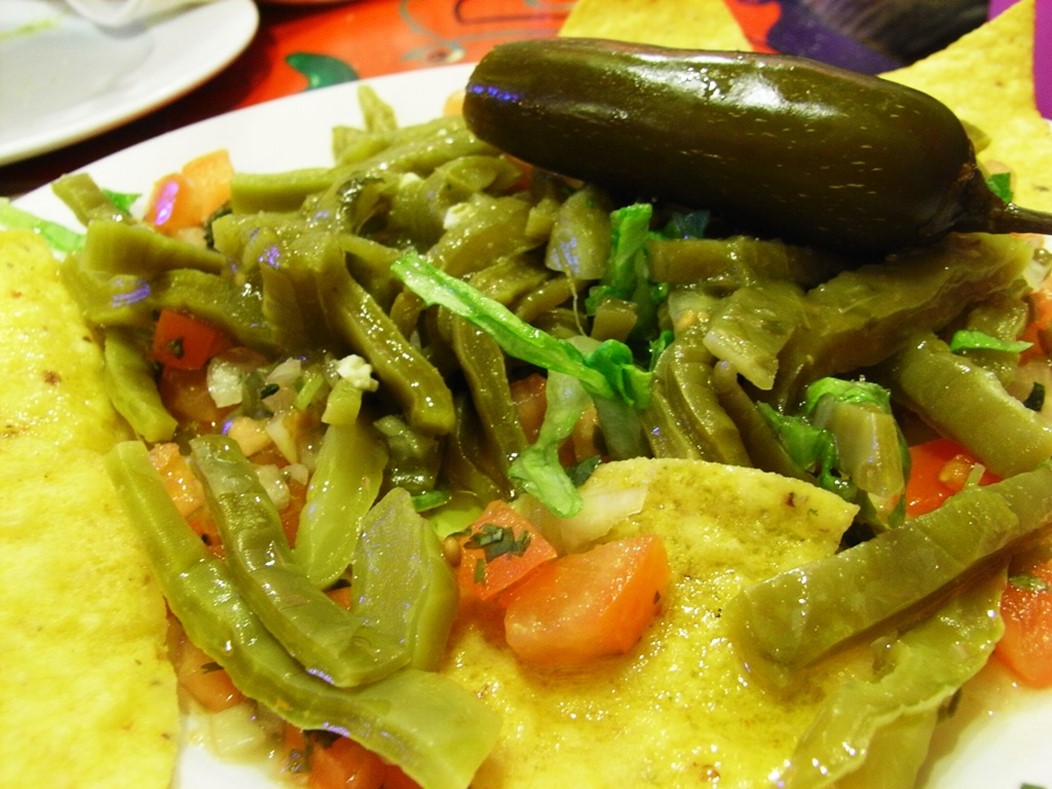 Mexican nopal salad with cleaned and cooked strips of pads from the prickly pear cactus