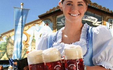 A waitress serves a traditional beer