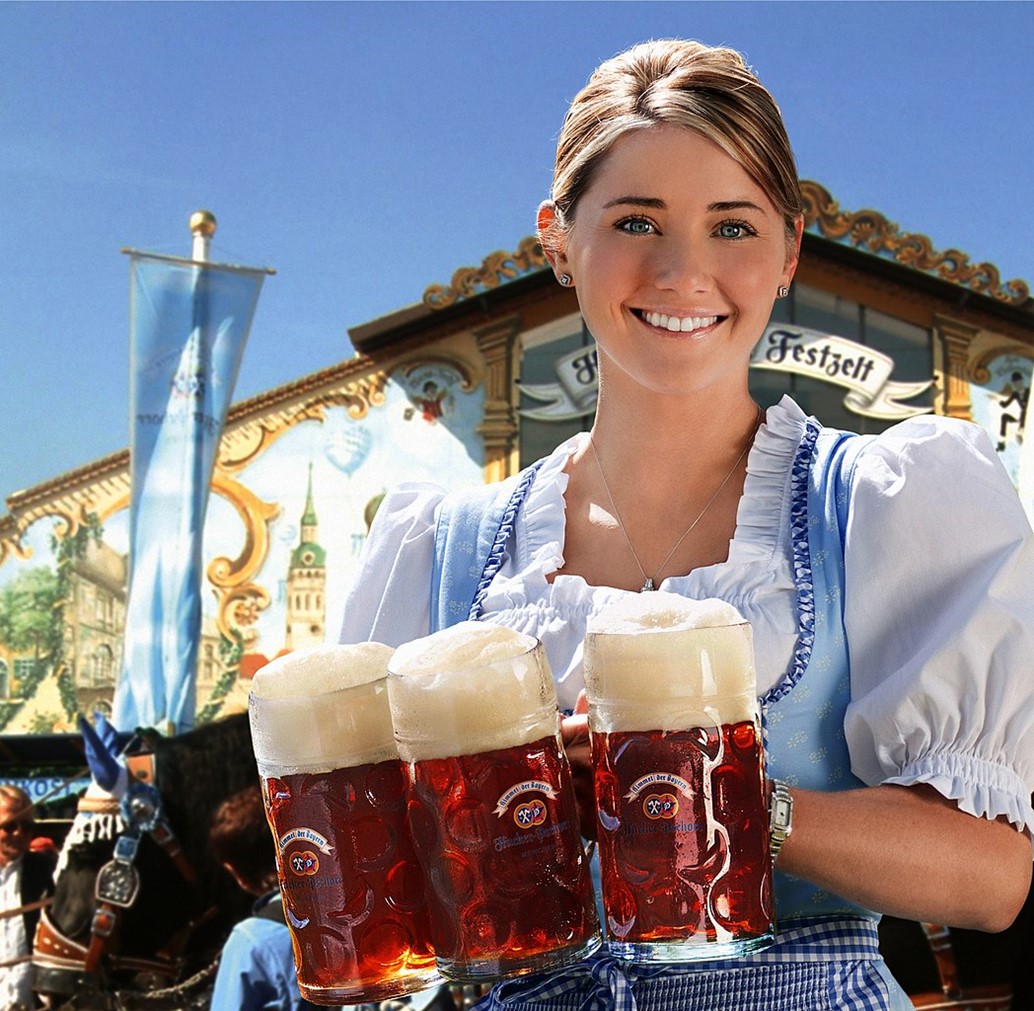 A waitress serves a traditional beer