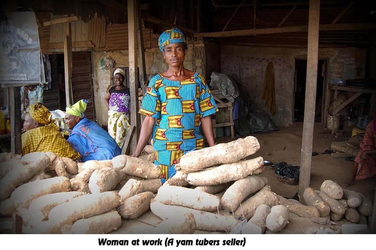 A woman selling yams