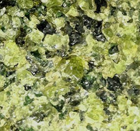 Peridotites are coarse-grained ultramafic mantle rocks mostly made up of green olivine and black pyroxene.