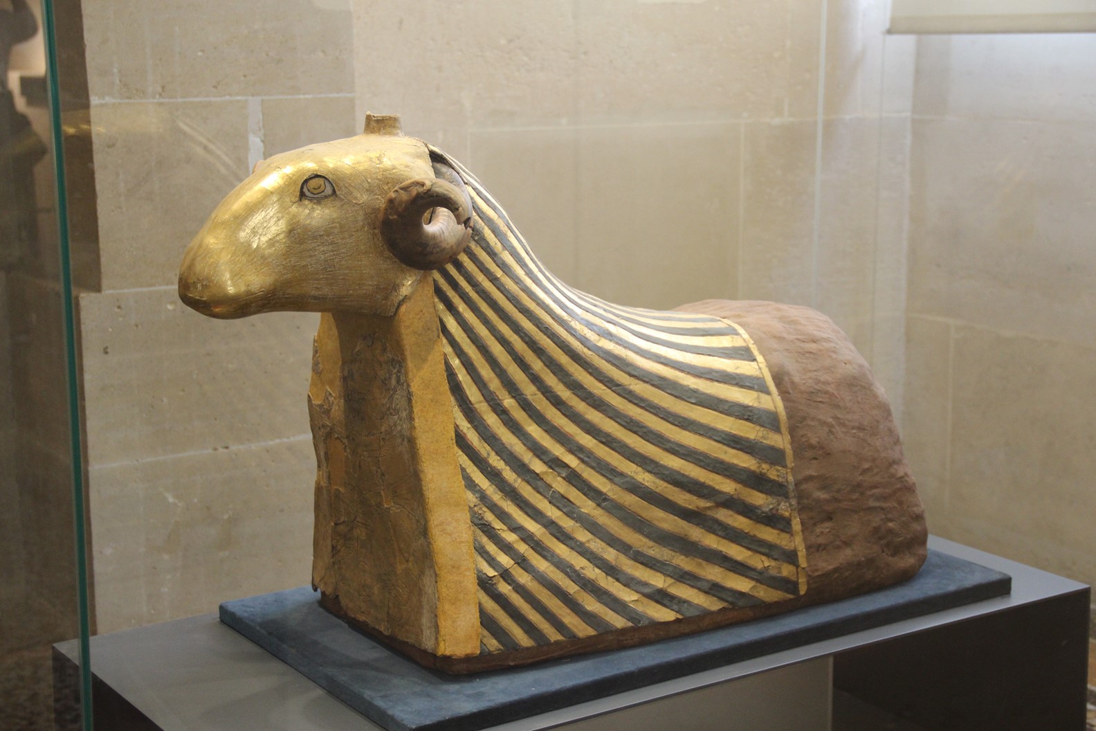 This gold foil covered lamb from Ancient Egypt can be seen at Ancient Egypt Gallery, Louvre Museum, Paris, France