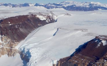 A glacier flows through a section of the McMurdo Dry Valleys in Antarctica.
