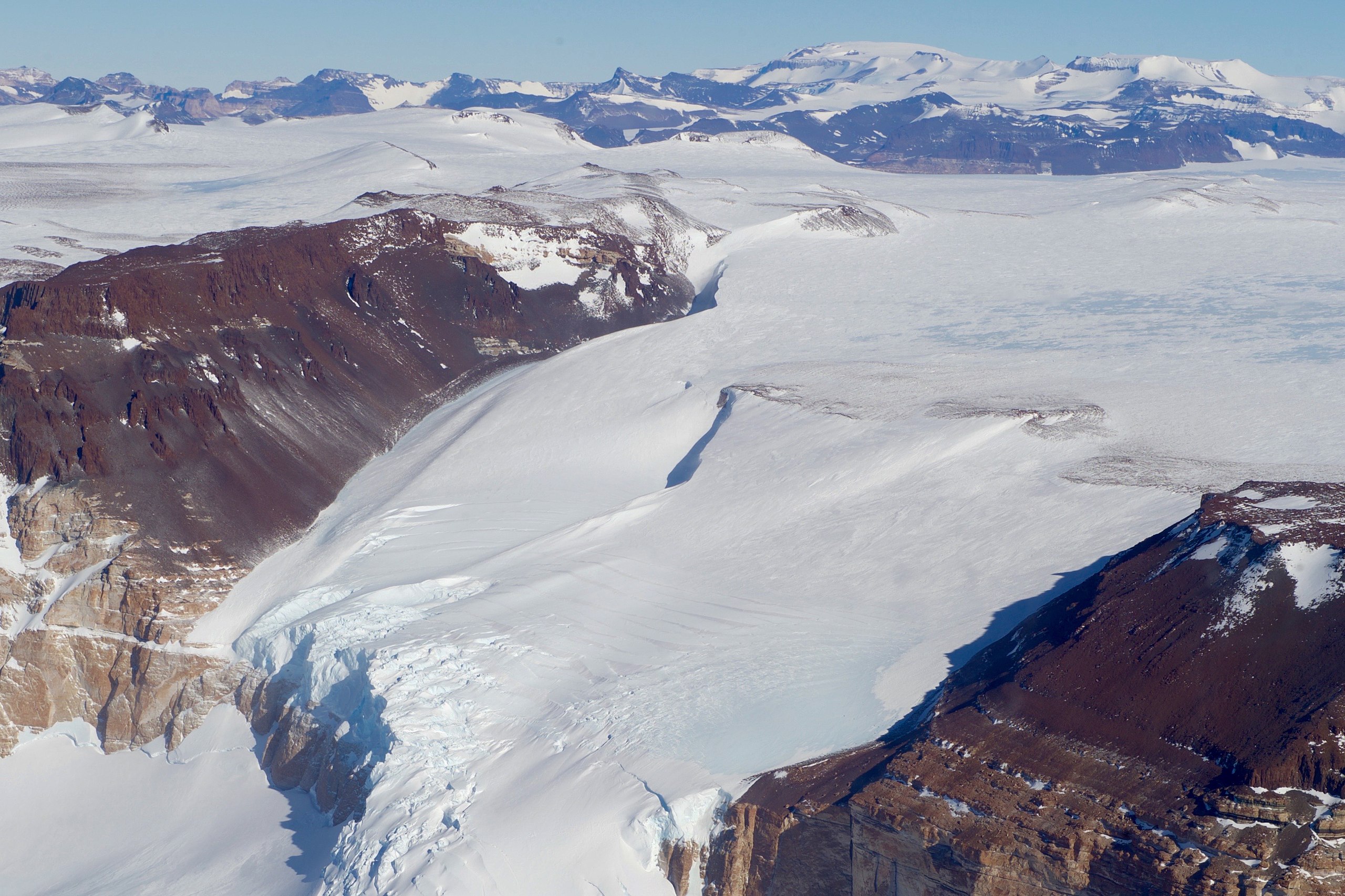 A glacier flows through a section of the McMurdo Dry Valleys in Antarctica.