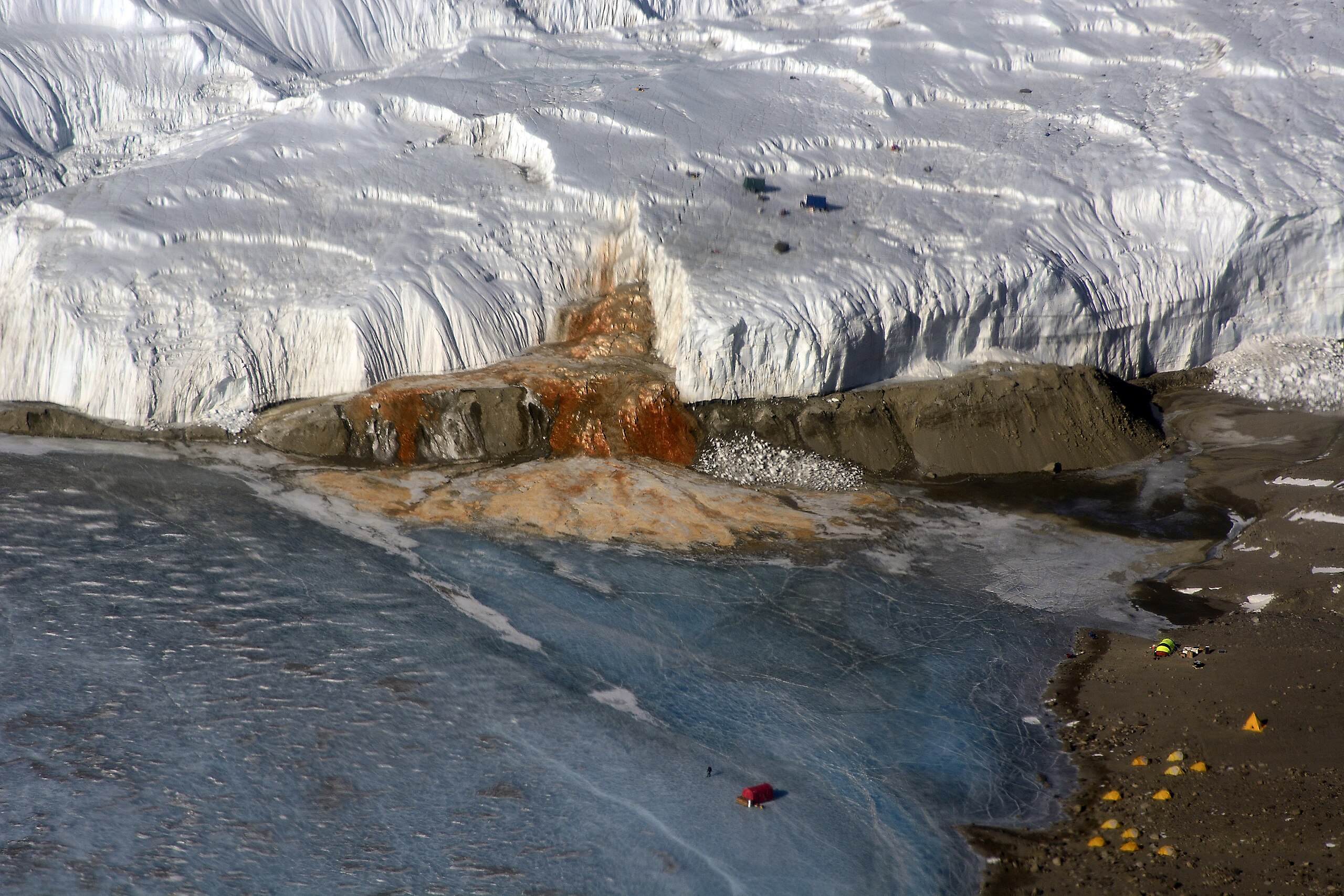 Blood Falls at the terminus of Taylor Glacier in the McMurdo Dry Valleys, releasing iron-rich brine into Lake Bonney.