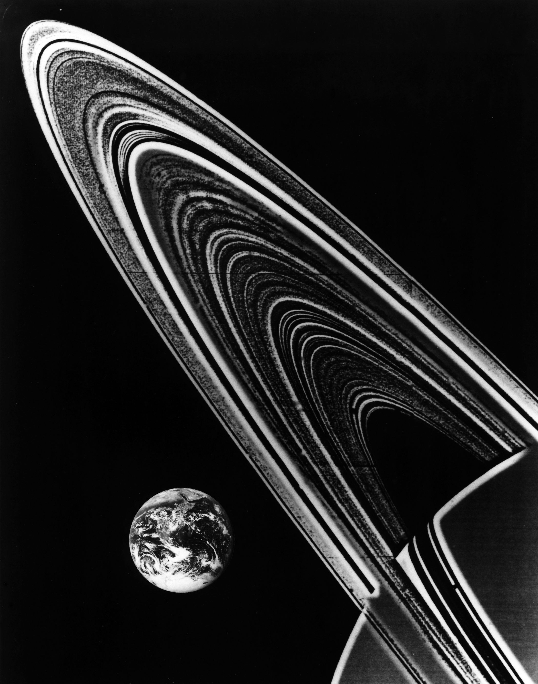 Saturn’s rings, with Earth for scale. Some of the rings have a width five times bigger than the Earth’s diameter. 