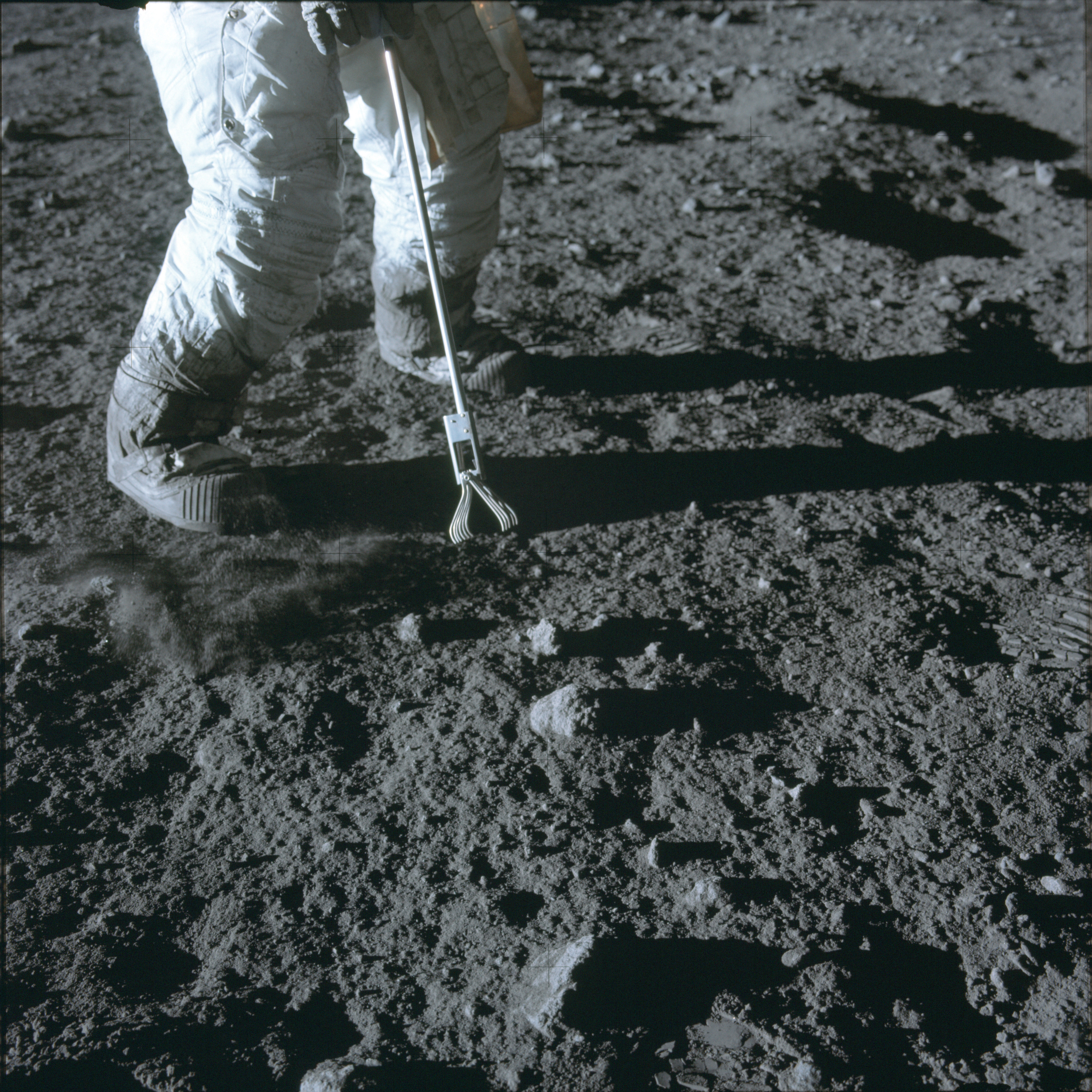 An astronaut on the Apollo 12 mission taking a lunar soil sample in 1969, the second crewed mission to land on the moon, to find out more about the moon’s composition.