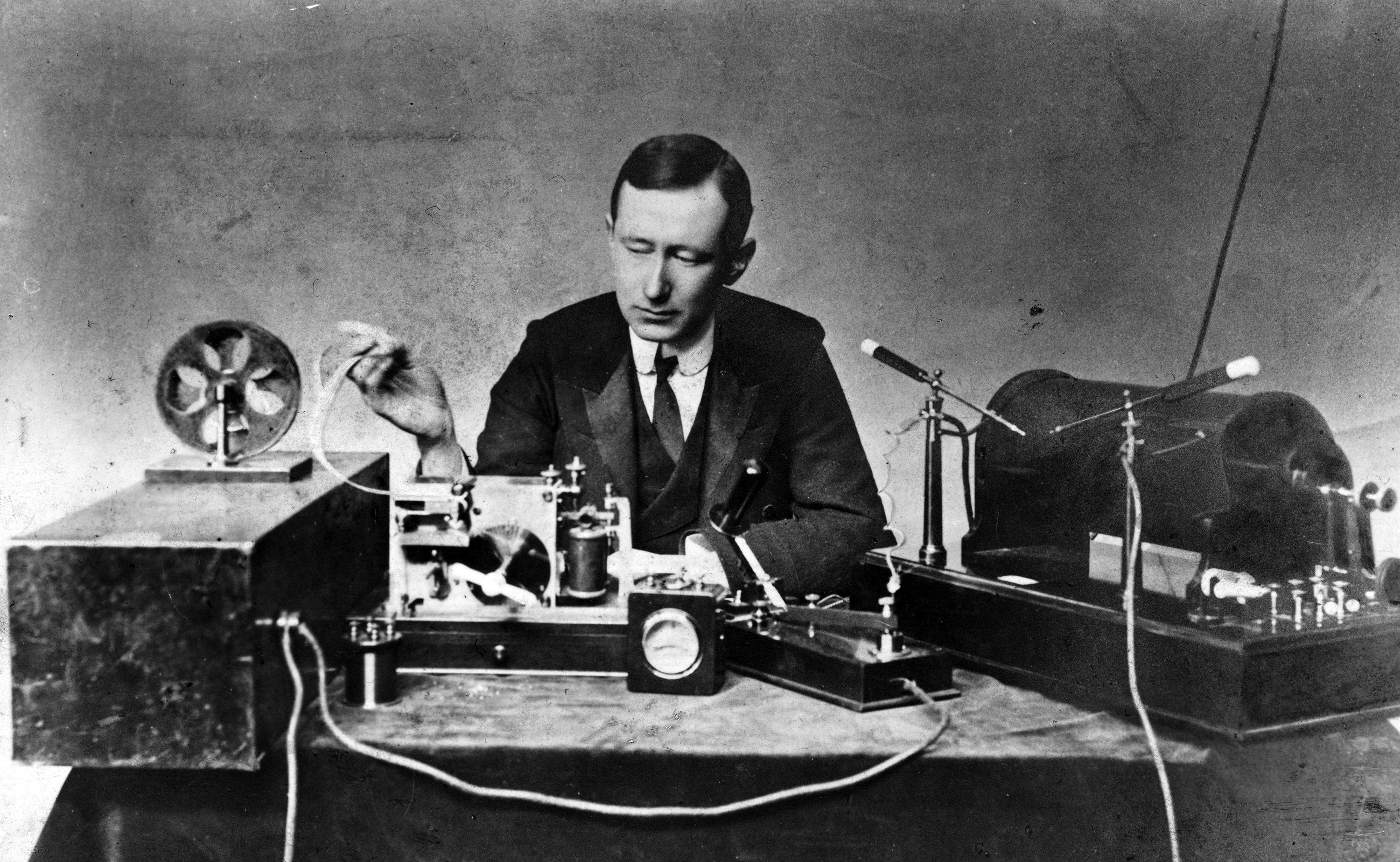 Engineer and inventor Guglielmo Marconi demonstrates his spark-gap transmitter, used in his first long distance radio transmissions during the 1890s.