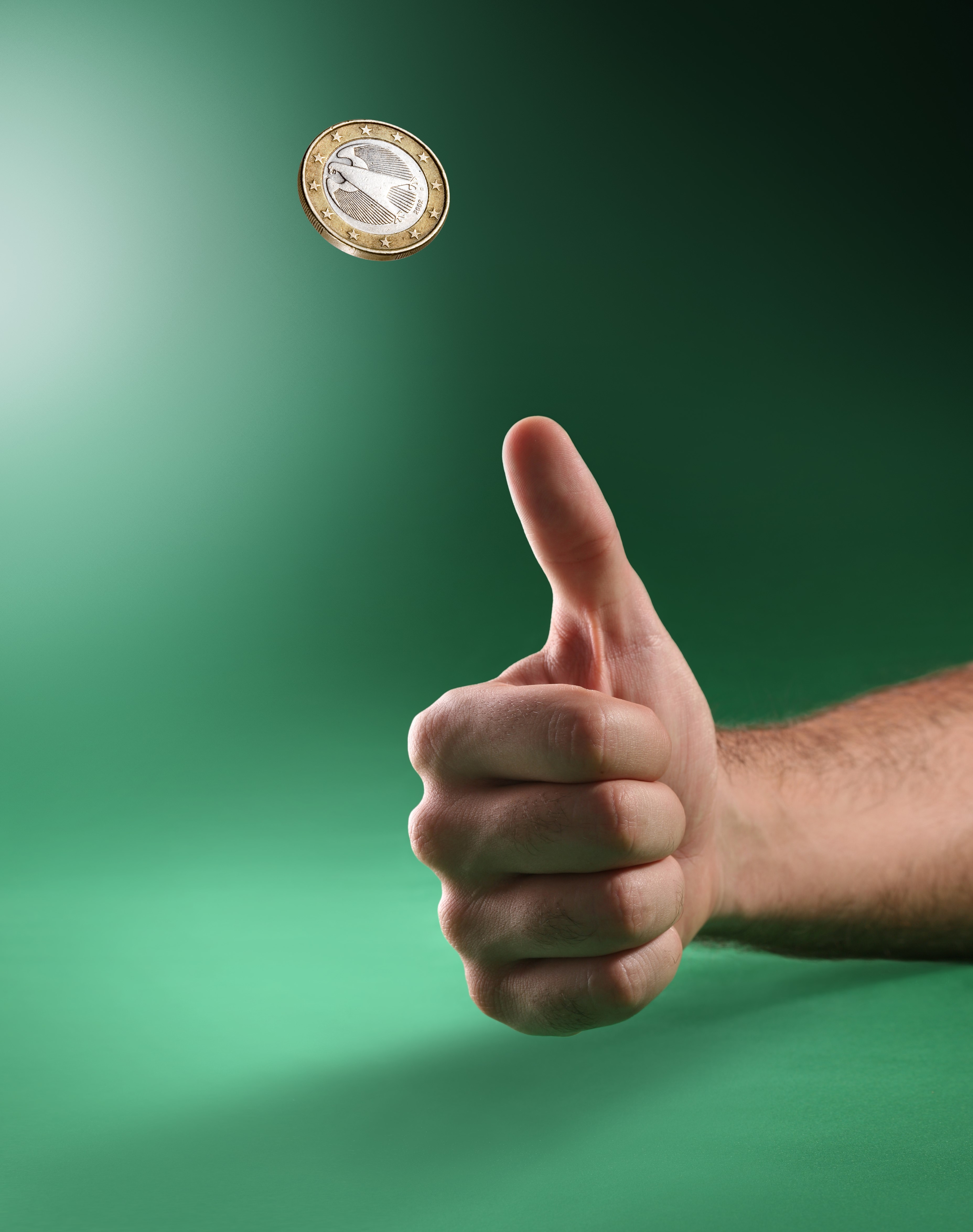 A person flipping a coin