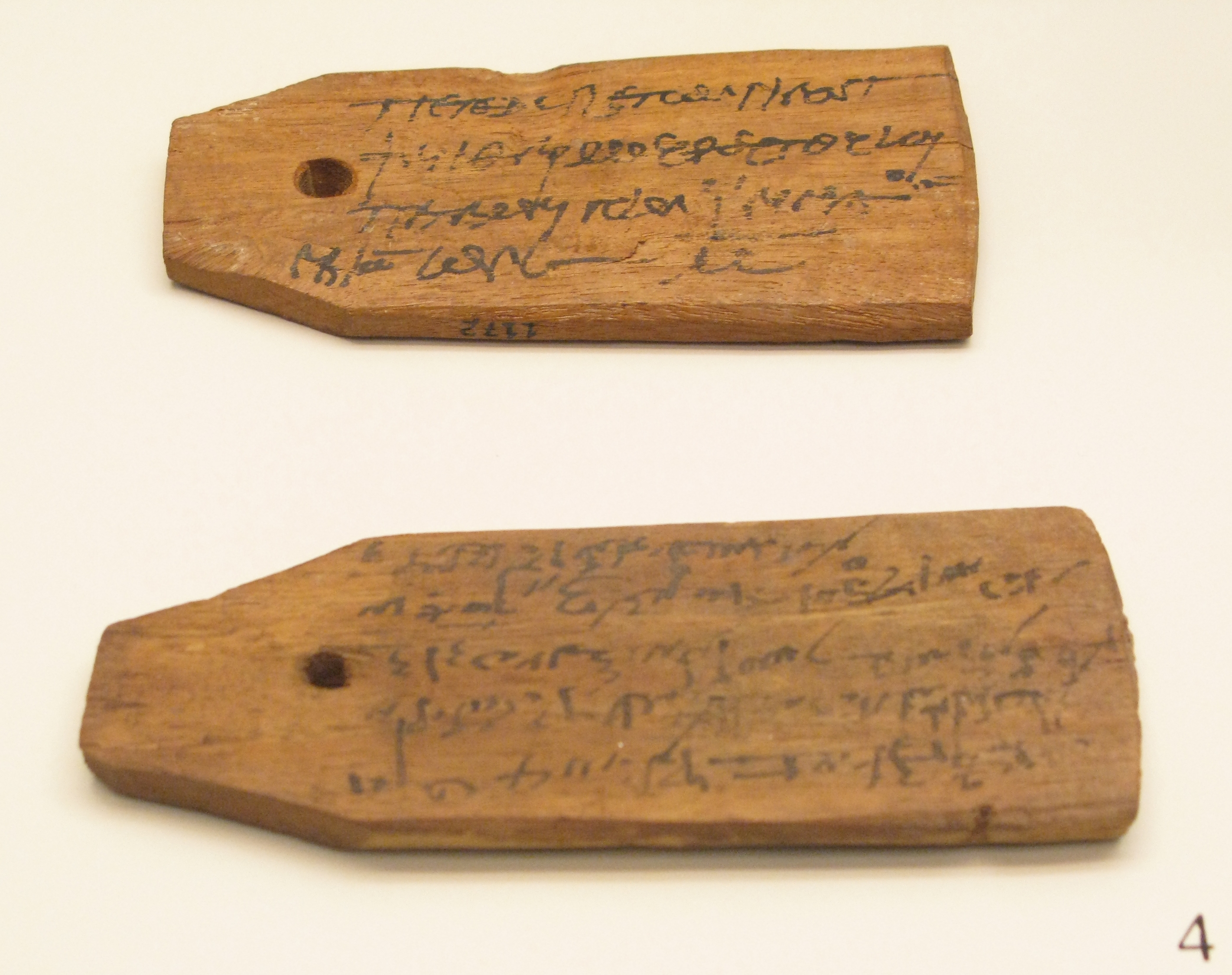 EarthDate 444-4 wooden tablets used to identify bodies