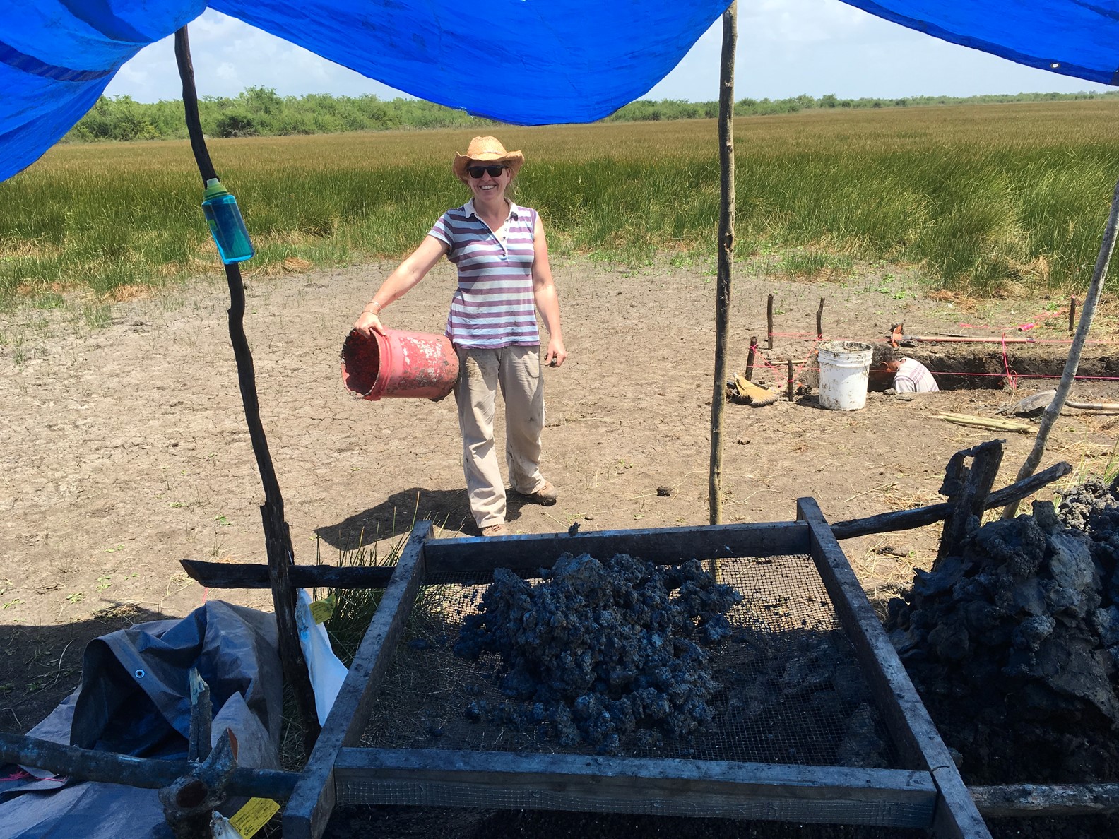 EarthDate 447-3 Dr. Eleanor Harrison-Buck performing wetland excavations in the Crooked Tree Wildlife Sanctuary.