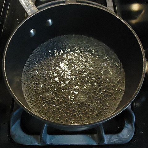 Boiling water to create a cloud of steam leaves impurities behind. Condense the water on a cooler surface and collect it into a vessel to drink.