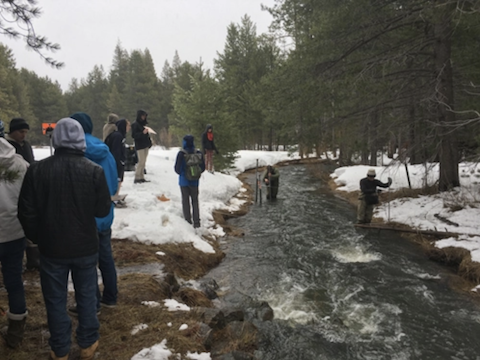 Students learning how to measure streamflow