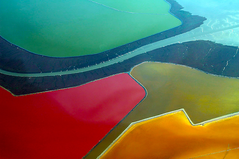 colorful patchwork of salt evaporation ponds