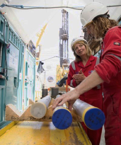  Joanna Morgan (left) and Sean Gulick examining core samples